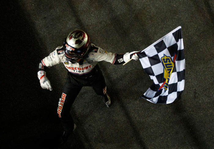 Austin Cindric makes it official, taking the checkered flag after winning the 64th Daytona 500 on Sunday. (Photo by Sean Gardner/Getty Images)